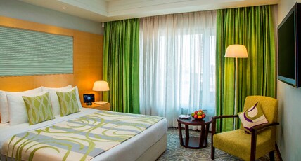 Radisson Blu Hotel Ahmedabad Room Type - Suite-Living Room with one way Airport Transfer