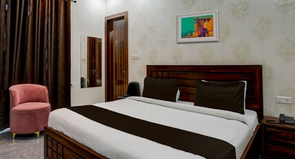 Hotel Aastha Shree Dham Room Type - Deluxe Room with Balcony