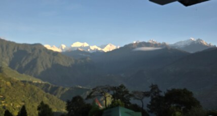 Sikkimese Inn Room Type - Deluxe King Bed Room with Mountain View