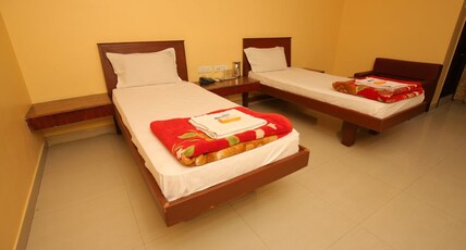 Malar Residency Room Type - Deluxe Twin room AC