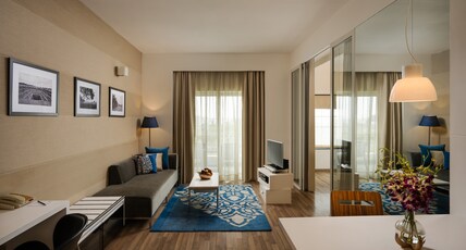 Grand Mercure Bangalore - An Accor Brand Room Type - One Bedroom Suite with Balcony, living room Grand Mercure Bangalore - An Accor Brand Room Type - One Bedroom Suite with Balcony, living room