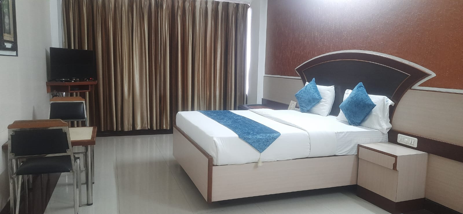 The Grand Krisha Rooms - Tap to explore photos