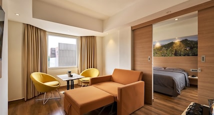 ASTORIA VEG Room Type - Suite Room with living room (2 Beds & 2 Washroom with Hill View) ASTORIA VEG Room Type - Suite Room with living room (2 Beds & 2 Washroom with Hill View)