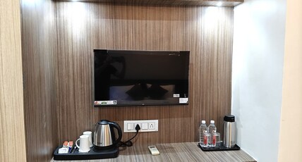 Glow Inn | Near Namo Ghat Room Type - Deluxe Superior AC Bedroom