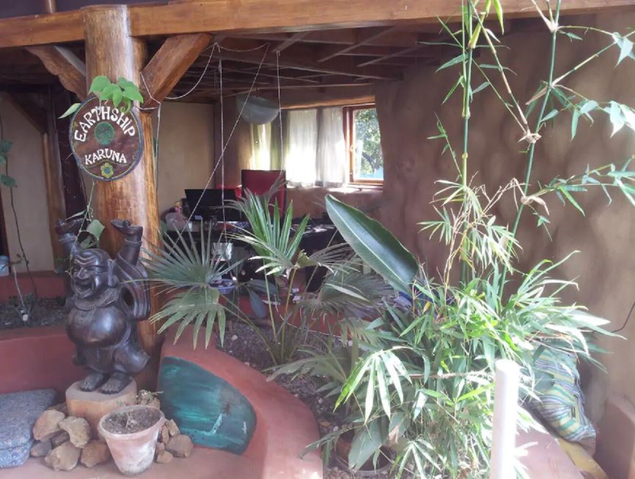 Earthship Karuna: Breathtaking Off Grid Eco Home - Tap to explore photos