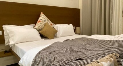 Saptashringa Holiday Home Room Type - Deluxe Room with Balcony and Hill View