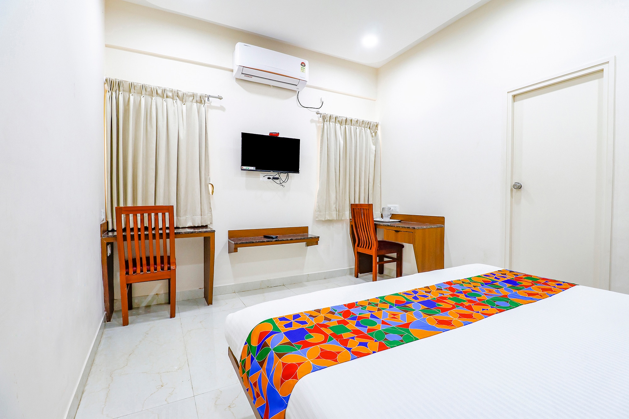 FabHotel Sathya Comforts - Nr. Commercial Street - Tap to explore photos