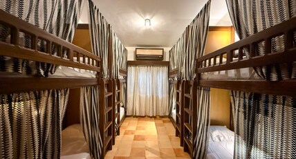 Malkin Hostel Room Type - Bed in 10 Bed Mixed AC Dormitory Room with Ensuite Bathroom