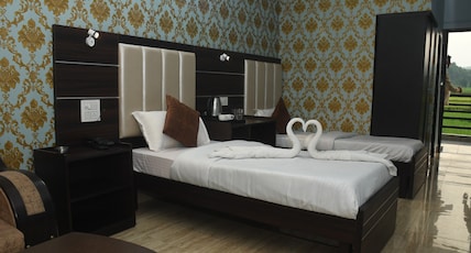Hotel Holiday Resort Room Type - Family Room Triple Bed (Air Conditioned with City View) Hotel Holiday Resort Room Type - Family Room Triple Bed (Air Conditioned with City View)