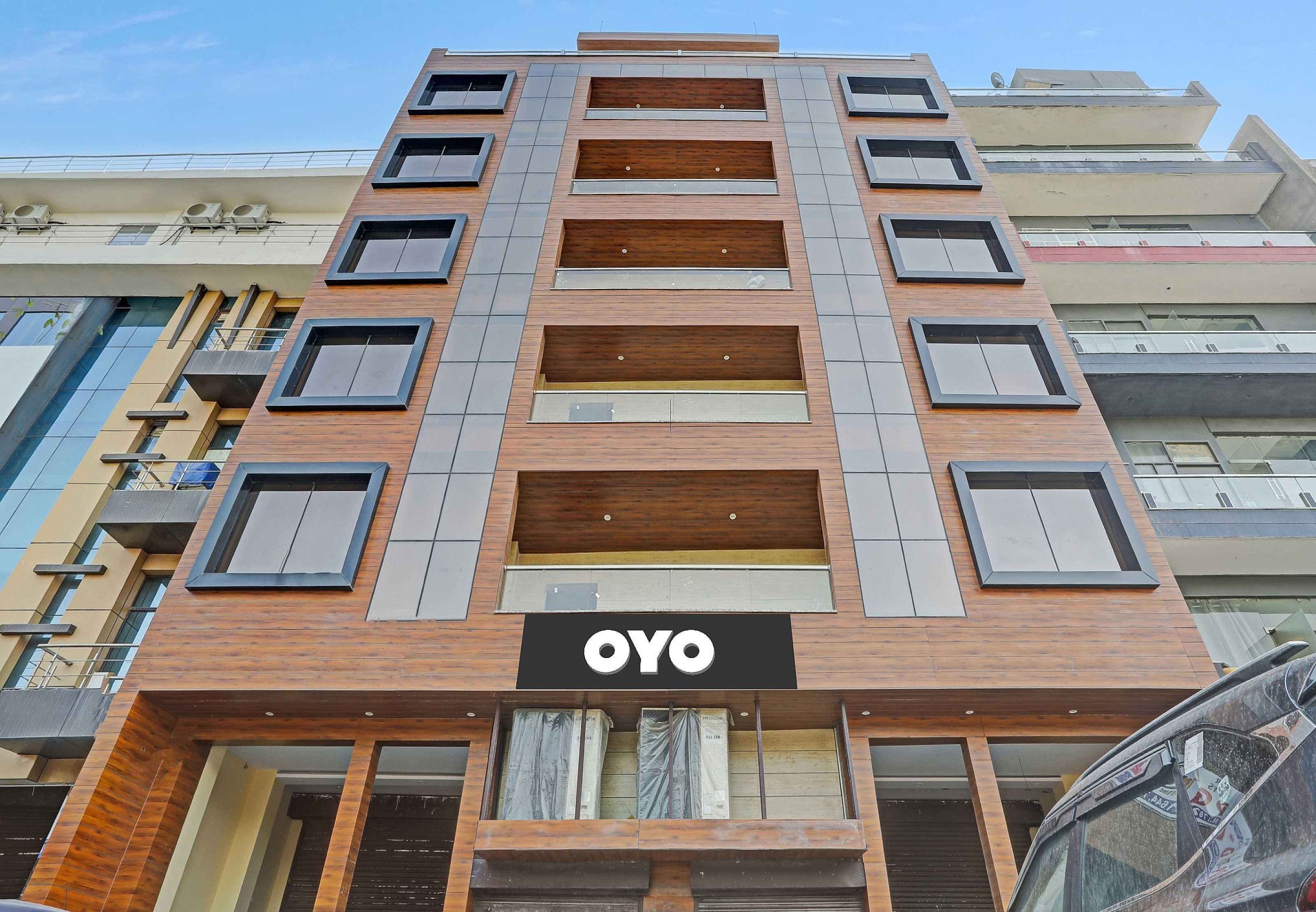 Capital O Mt Corporate Stays Near Iskcon Temple Noida - Tap to explore photos
