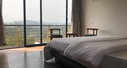 Western Ghats Holiday Homes | Mountain-view Rooms Room Type - king room with balcony