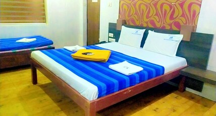 Hotel Sri Saravana Bhavan Room Type - AC Triple bed