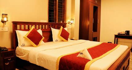 ASR Holidays ,Valparai Room Type - Budget Luxury Family room-202