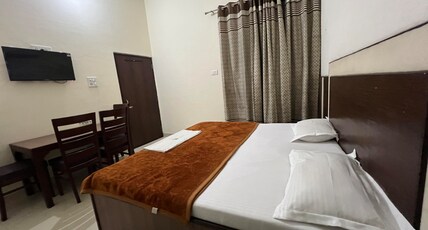 Raja Guest House, Near Railway Station Room Type - Deluxe Room