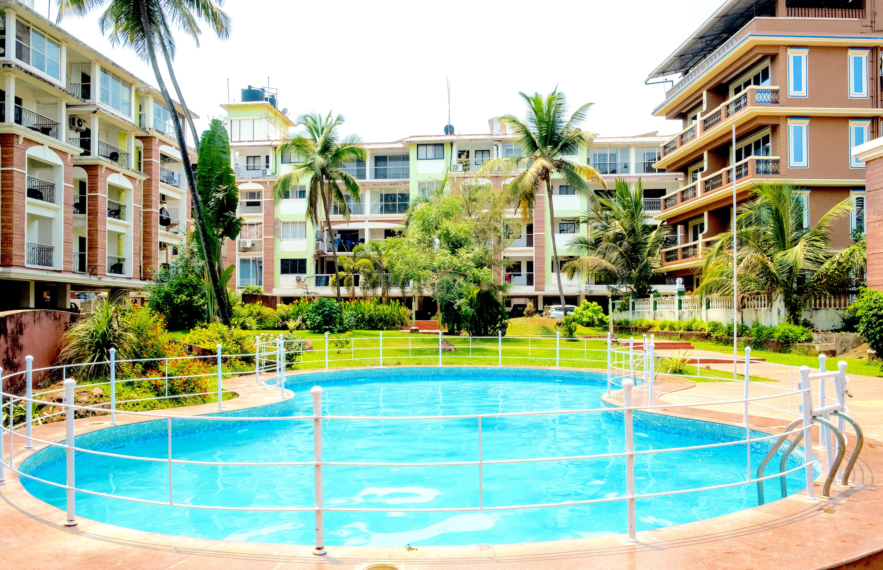 Comfortable studio room at candolim with free wifi pool and parking - Tap to explore photos