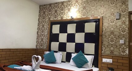 Hotel Raxit Inn Room Type - Deluxe Room