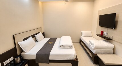 HOTEL PUJARI Room Type - LUXURY TRIPLE ROOM