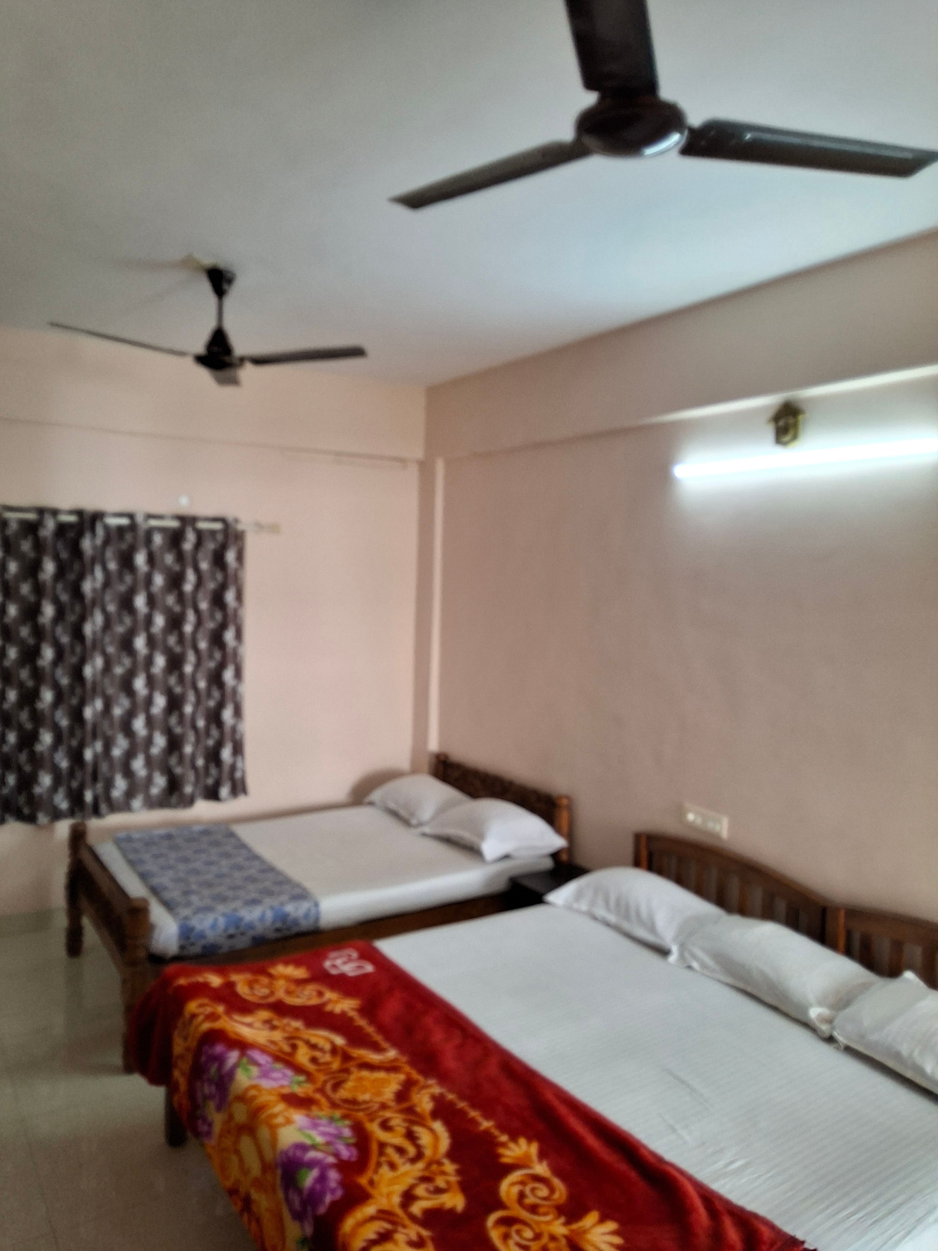 Vidhara Rooms | 5 min drive to KIMSHEALTH Hospital - Tap to explore photos