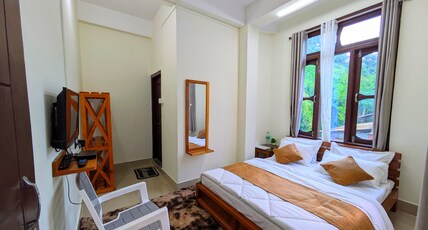 Accomoon hillside homes Room Type - Double bed deluxe room with hills view