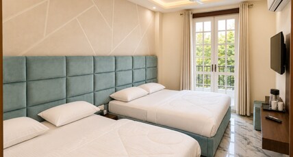 Hindustan Royal Inn Room Type - Quad Room with City View Balcony Hindustan Royal Inn Room Type - Quad Room with City View Balcony