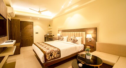 Ecotel Hotel Room Type - Executive Deluxe Room , 24 hrs checkin and checkout , 15 percent discount on Food Bill Ecotel Hotel Room Type - Executive Deluxe Room , 24 hrs checkin and checkout , 15 percent discount on Food Bill