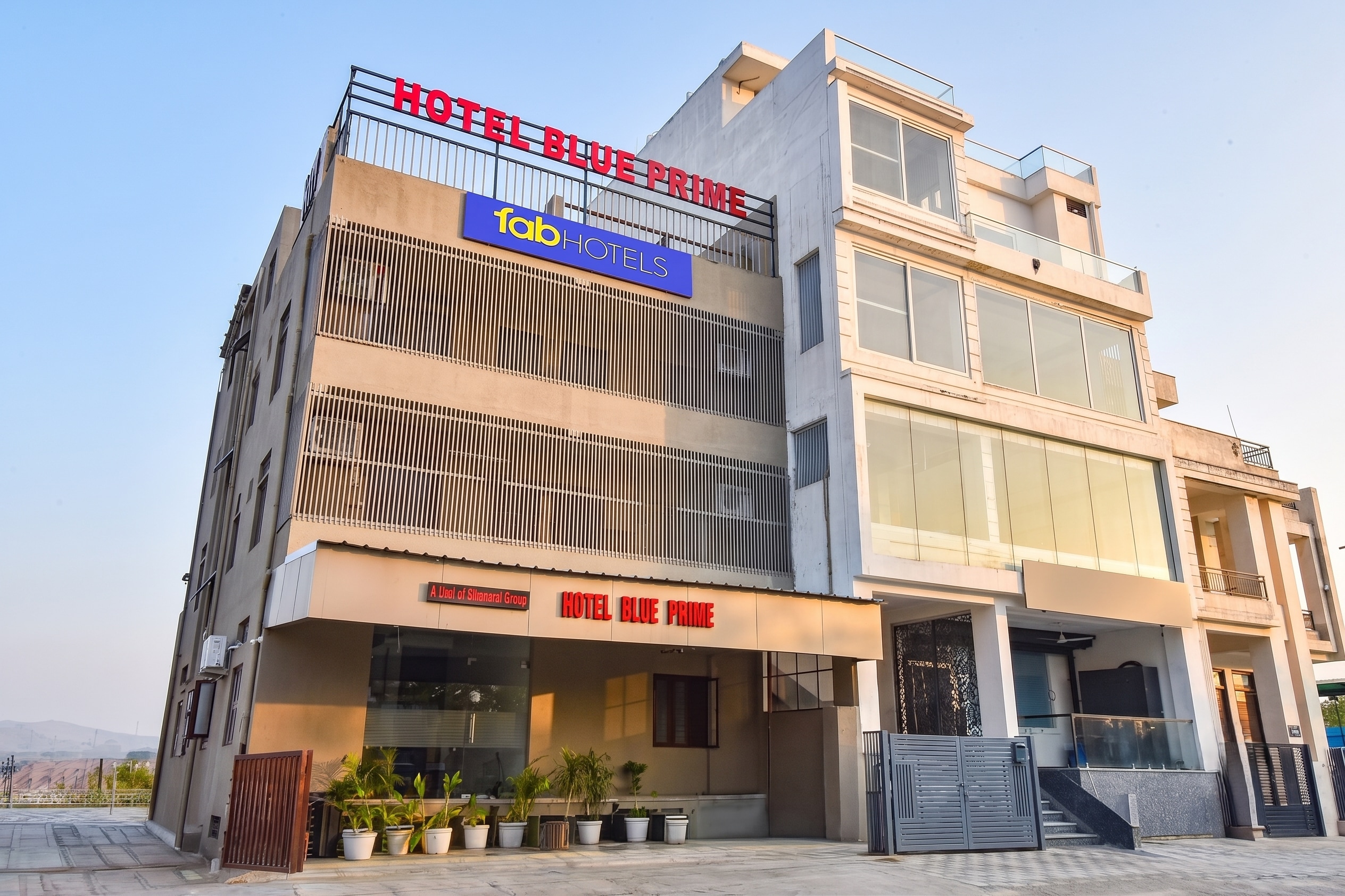 FabHotel Blue Prime - Nr Suvira Hospital - Tap to explore photos