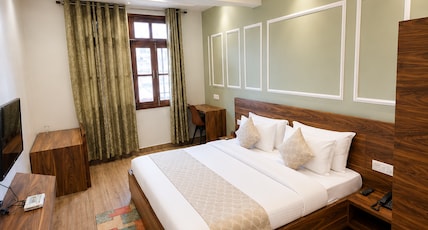 Hotel Meghna Room Type - Deluxe Room - over 170sq ft comes with a study table , dining table, Free Wifi Hotel Meghna Room Type - Deluxe Room - over 170sq ft comes with a study table , dining table, Free Wifi