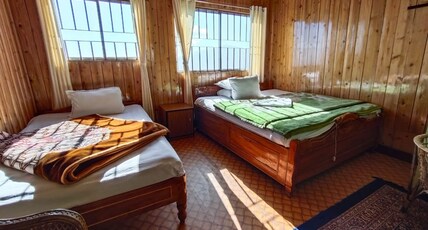 HOTEL NIRALA Room Type - VIEW SIDE DELUXE TPL BED ROOM