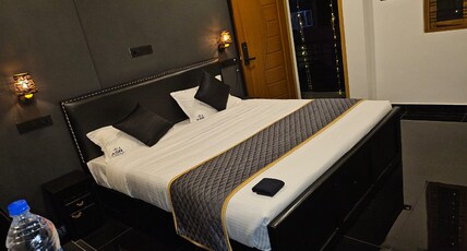 ASR Holidays ,Valparai Room Type - Black and white room-204