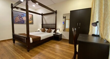 Udupi Inn | Rooms & Dorms Room Type - King Suite with Private Garden