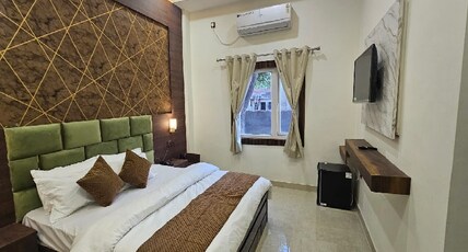 Triveni International Room Type - Deluxe Room