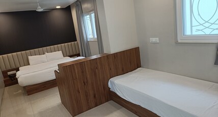 Radhakrishna Executive Lodge Room Type - Family Room (1 Double And 2 Single Bed)