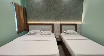HOTEL SREE DURGA Room Type - AC Deluxe Triple Bed