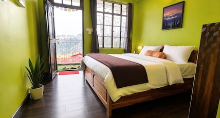Eagle Point Homestay | Rajbari Room Type - Deluxe Double Bed room with Balcony ( Kanchenjunga and Darjeeling town view ) Eagle Point Homestay | Rajbari Room Type - Deluxe Double Bed room with Balcony ( Kanchenjunga and Darjeeling town view )