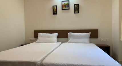 Vennela Hotel Apartments | Rooms & Caretaker Room Type - Deluxe Twin
