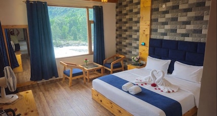 The Riverside Guest House Room Type - Mountain and River View Without Balcony Room The Riverside Guest House Room Type - Mountain and River View Without Balcony Room