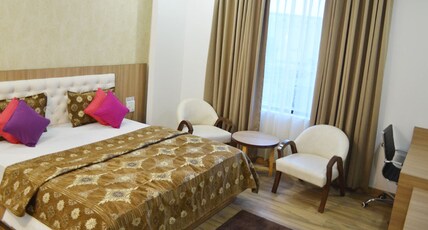 Emmkay Residency Room Type - Deluxe Room