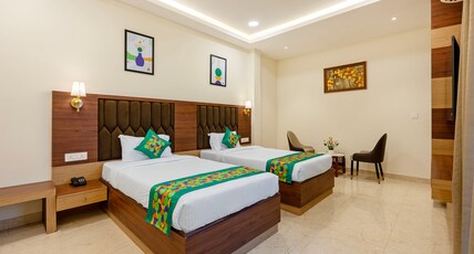Treebo Premium Pine Tree Courtyard Room Type - Deluxe Room with Mini Fridge