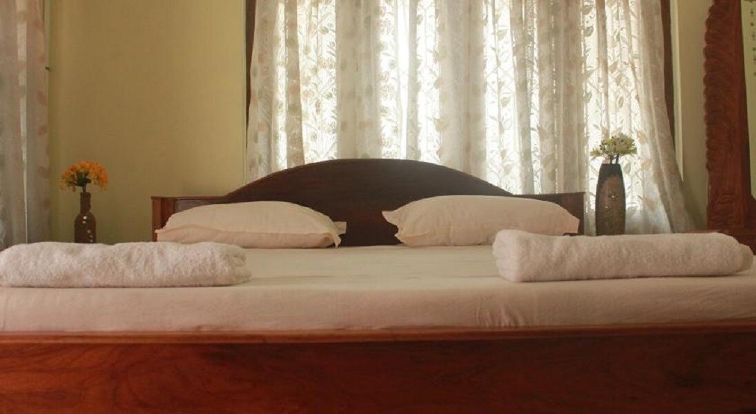 Coral Isle Bed & Breakfast | Rooms & Caretaker - Tap to explore photos