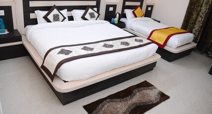 Hotel Rakhee Palace  Room Type - Super Deluxe Triple Bed Room AC (Free pick-up and drop from Rly St.,Helipad and Ban Ganga)