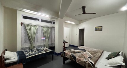 Tasks Inn Guest House Room Type - Deluxe room