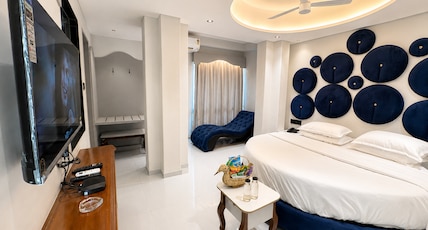 Hotel Nova Bloom Room Type - Premium Round Bed Suite with 245 Sofa and 55 Inch Android Smart T.v for Netflix and Chill Hotel Nova Bloom Room Type - Premium Round Bed Suite with 245 Sofa and 55 Inch Android Smart T.v for Netflix and Chill