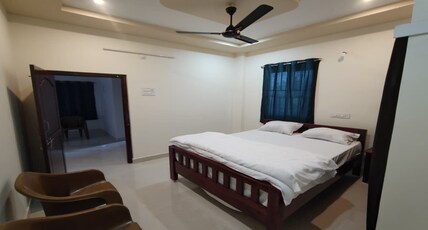GVM Guest house, Malikipuram Room Type - Deluxe Room with Garden View Bed