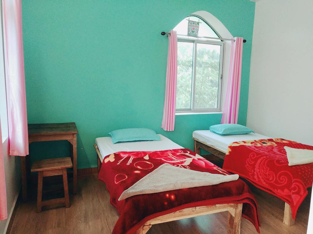 Senamura Yoga Ashram Guesthouse - Tap to explore photos