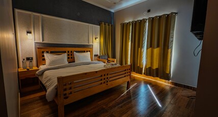 Bhimtal The Jyun Stays Room Type - Deluxe room with forest view.