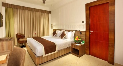 EMBASSERY RESIDENCY Room Type - DELUXE ROOM AC