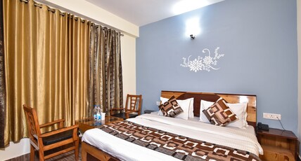 Hotel Him Regency - 2 Mins drive from Volvo Bus Stand Room Type - Deluxe Room