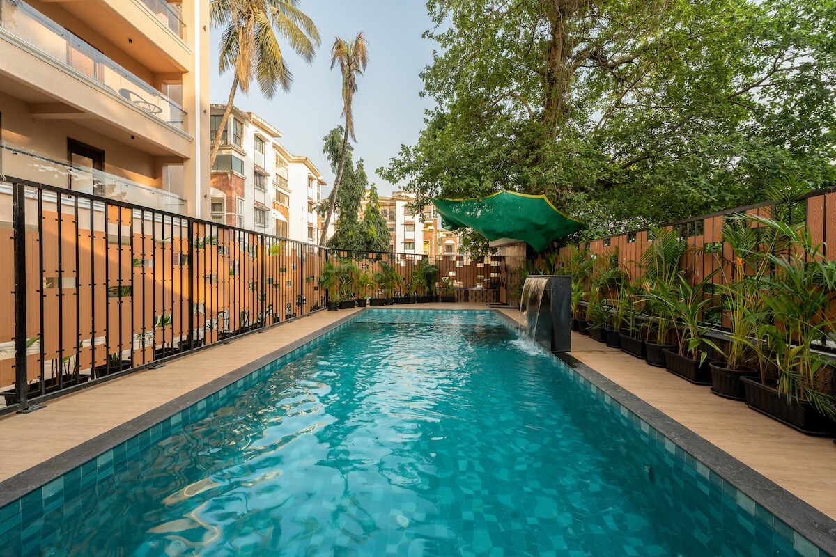 Modern 1BHK in Candolim w Pool & Gym Near Beach | Hireavilla - Tap to explore photos