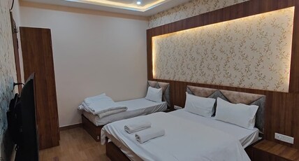 Hotel Mangal Murti Room Type - Deluxe Triple Room