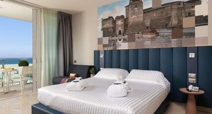 Mercure Rimini Artis Room Type - Privilege Room with double bed and single bed, overlooking the sea